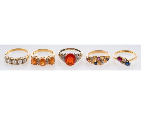 Five gemset rings, including an 18ct gold, sapphire, ruby and diamond cross-over ring; a 9ct gold fire opal and diamond ring;