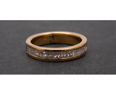 A step and princess-cut diamond half eternity ring, total estimated diamond weight ca. 0.80cts, I-J colour, VS2-SI1 clarity, 