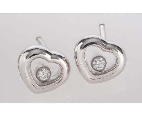A pair of Chopard 'Happy Diamond', heart-shaped ear studs, signed Chopard, total estimated diamond weight ca. 0.10ct, with Sw