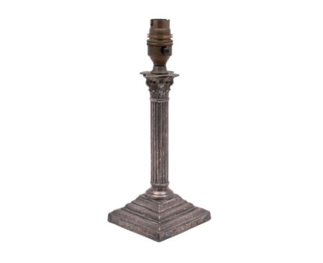 An early 20th century silver plated Corinthian column candlestick table lamp on a stepped square base, 26cm high.