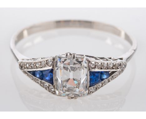 An Art Deco rectangular mixed-cut diamond ring, flanked by calibre-cut sapphires and single-cut diamonds, estimated weight of