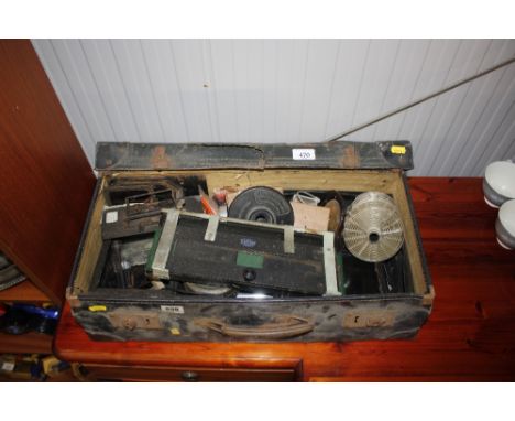 A rectangular leather trunk and contents of various photographic development items 