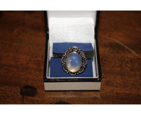 A white metal and moonstone dress ring 