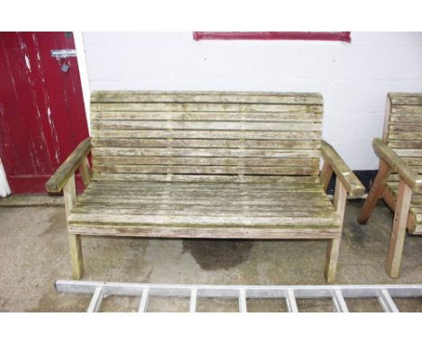 A wooden three seater garden bench 