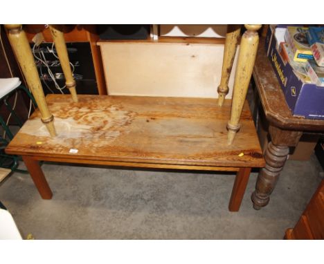 A low stripped pine bench 