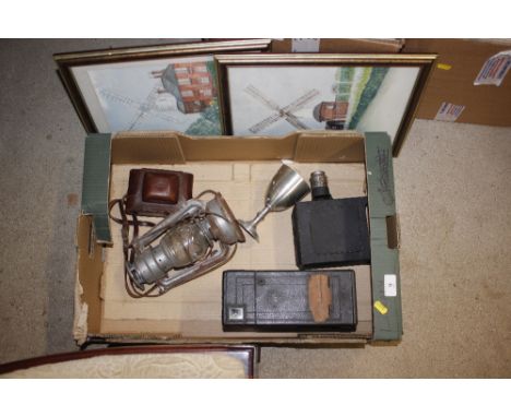 A vintage camera (incomplete); part of a Magic Lantern; two watercolours; Hurricane lamp etc.