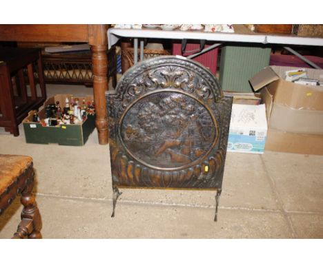 A copper embossed fire screen 