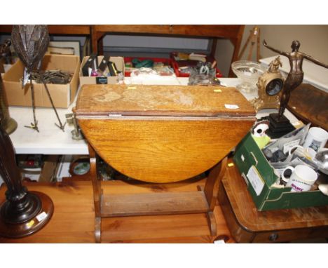 A light oak drop leaf coffee table