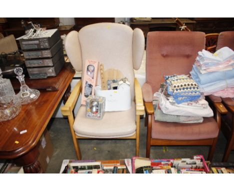 A modern light wood wing back armchair 