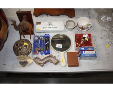 A hand mirror; various ornaments; souvenir spoons; retro alarm clock; travelling alarm clock etc.