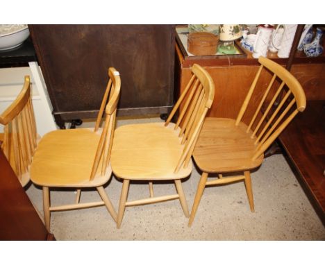 An Ercol stick back kitchen chair; and four Ercol style stick back chairs