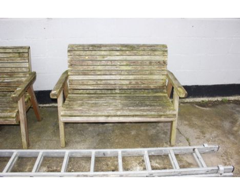 A wooden two seater garden bench