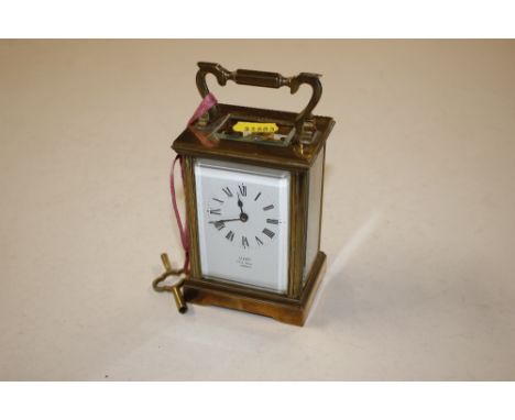 A brass cased carriage clock retailed by dent of Pall Mall