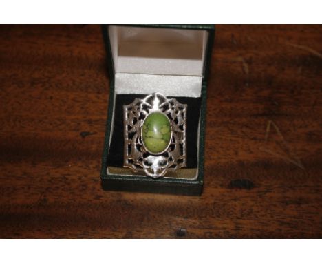 A white metal and green agate dress ring