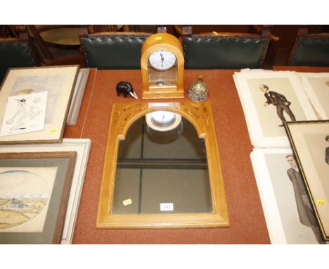 An inlaid framed wall mirror; a mantel clock; brass table bell; and an ebony elephant