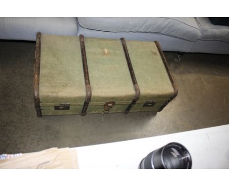 A canvas and battened vintage trunk