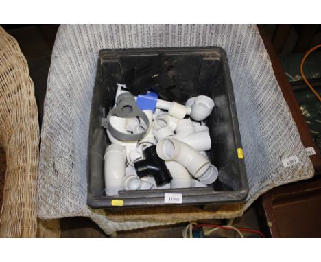 A crate of waste pipe fittings