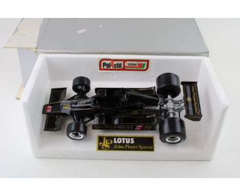 A boxed die cast  Polistil Lotus John Player Special 1/18 scale F1 car. Width 29cm.  Die cast model in VG / G condition, deca