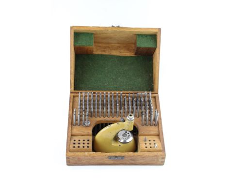 An oak cased vintage watchmakers, Jeweling tool set / staking set. Height 12cm.