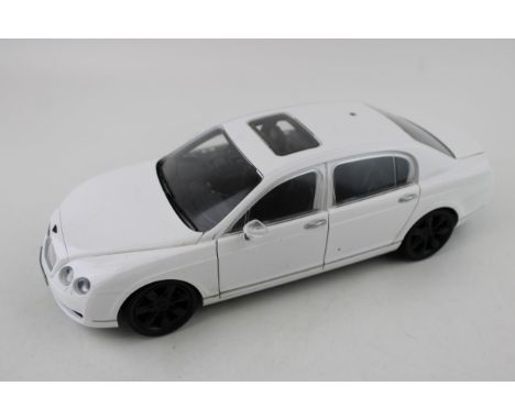 Paul's Model Art 'Minichamps' Bentley Continental Flying Spur in white, 1/18 scale.  Vendor states items were sourced from th