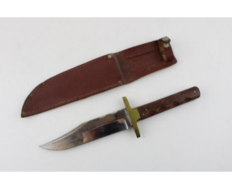 A Bowie Knife in original sheath by J. NOWILL &amp; SONS Sheffield. Length  26cm.  In good original condition with some light
