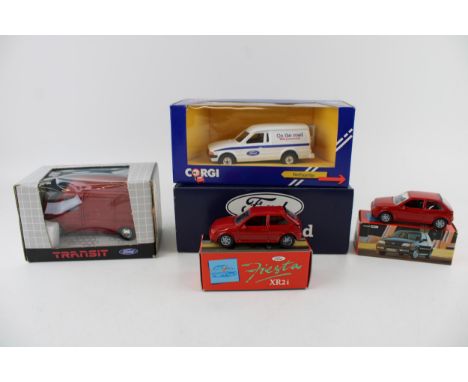 A Schabak 1:35 scale Ford Transit Van No 1300 / 1301 in red together with a Corgi Ford Escort Van 'On The Road' together with