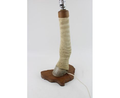 A mid century zebra leg lamp on a wooden base in the shape of Africa  very good condition 40cm tall