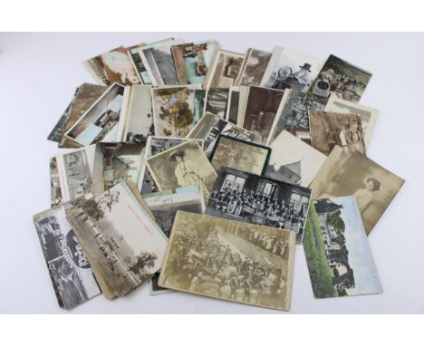 A collection of late 19th and early 20th century postcards and photo cards to include holiday destination postcards, of note 