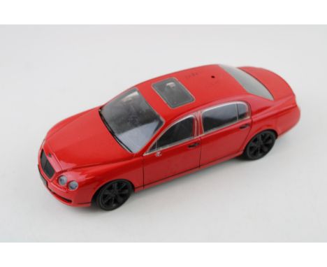 Paul's Model Art 'Minichamps' Bentley Continental Flying Spur in red, 1/18 scale.  Vendor states items were sourced from the 