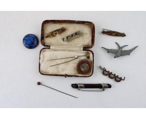 A collection of antique costume jewellery to include bar brooches, stick pins, hat pins, Art Deco swallow brooch, Arts and Cr