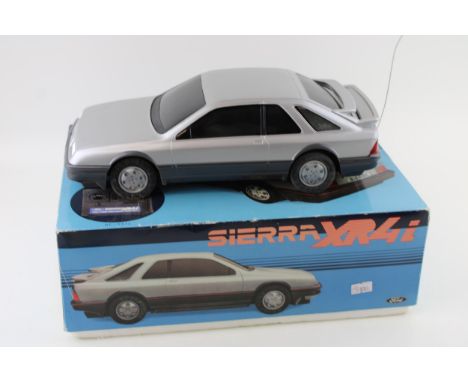 Boxed remote control Ford Sierra XR4i by Asahi, width 31cm.  As new in box. Model VG / G, box VG / G with some light marks th