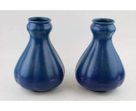 A large pair of Royal Lancastrian vases, mottled blue decoration, shaped, 25.5cm tall (2).  In good condition with no obvious