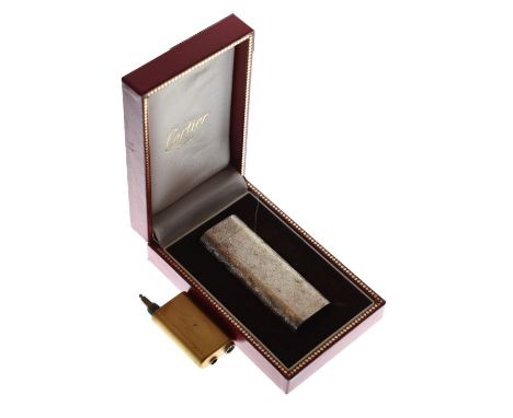 Cartier silver plated flattened cylindrical lighter having matted decoration, with a Cartier reservoir, cased   Condition: 