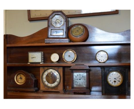 Ten assorted clocks and barometers to include; American mantel clock, German mantel clock by Junghans etc   Condition: 