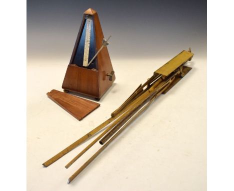 Metronome and folding music stand   Condition: 