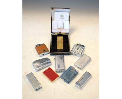 Dunhill gold plated lighter, cased and a quantity of other lighters   Condition: 