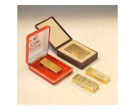 Dupont gold plated lighter, cased, together with two Colibri lighters and one other similar   Condition: 