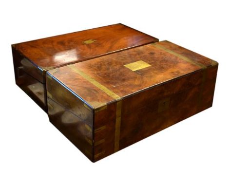 Two Victorian lap desks or writing boxes comprising: a brass-bound figured walnut example, and another in mahogany, the first