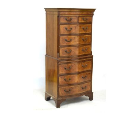 Old reproduction serpentine-fronted walnut chest on chest or tallboy of small proportions, the upper stage with two short ove