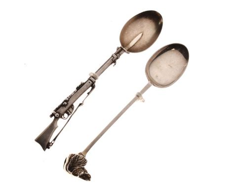 Two novelty souvenir spoons, one having the handle formed as a rifle, the reverse of the bowl engraved 'Agra Vol Rifles', Che