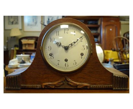 1920's period oak cased mantel clock of 'Napoleons Hat' design with three-train chiming movement   Condition: 
