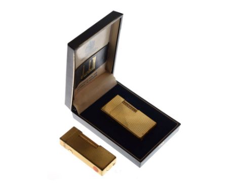 Dunhill gold plated lighter, cased and one other similar Dunhill lighter   Condition: 