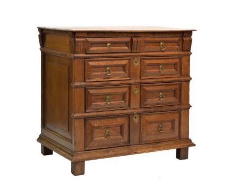 Late 17th Century oak geometric chest of drawers, the moulded two-plank top over incised frieze and four graduated long drawe