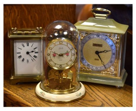 Three clocks comprising a brass-cased carriage timepiece, small anniversary/torsion clock, and green onyx mantel clock (3)   