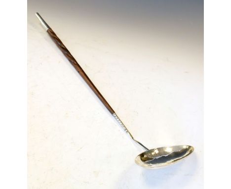 Georgian unmarked white metal toddy ladle having an oval bowl and a turned hardwood handle   Condition: 