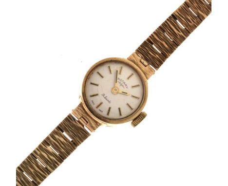 Lady's 9ct gold Rotary cocktail watch, the champagne dial with baton markers, on a textured conforming bracelet   Condition: 