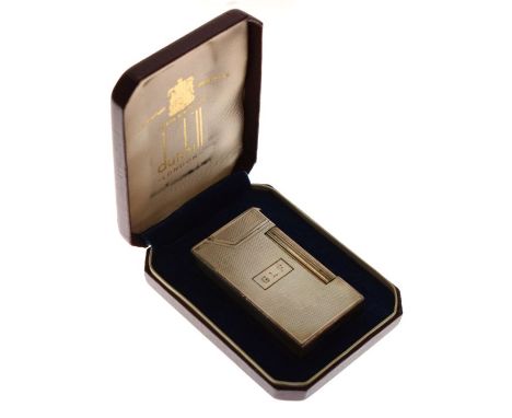 Dunhill sterling silver lighter having engine turned decoration and monogram G.L.S, cased   Condition: 