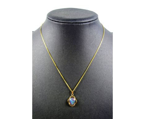 Opal cabochon set in a yellow metal pendant mount, stamped 9ct, gross 1.8 grams, on a yellow metal fine curb link necklace, s