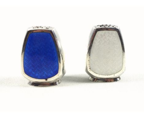 Pair of Danish silver and enamel pepperettes, one in blue and one in white, with foliate decoration, by A. Michelson, Copenha
