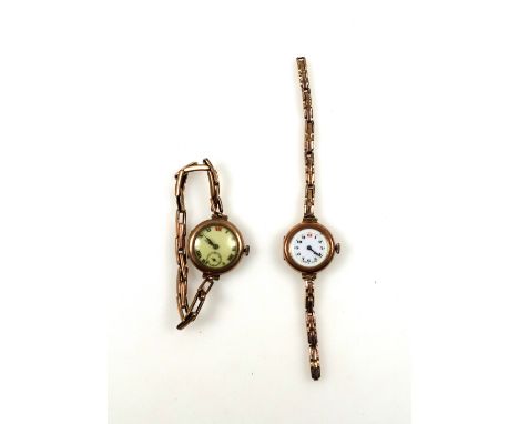 A lady's vintage 9ct rose gold wrist watch, with Arabic numerals to a white circular enamel dial on a stretch strap (broken),